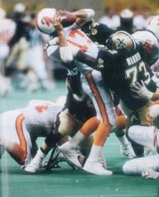 Frank Warren of the 1991 New Orleans Saints sacks Chris Chandler of Tampa Bay.