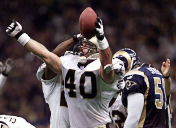 Brian Milne of the New Orleans Saints celebrates fumble recovery against the Rams in 2000 playoffs